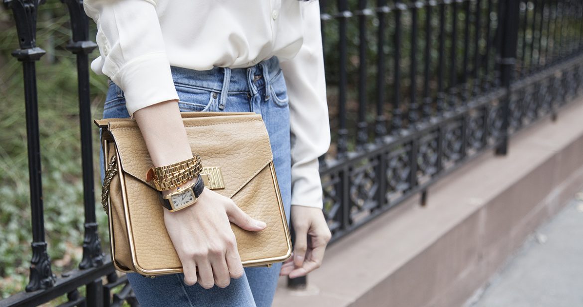 Cartier watch and brown handbag
